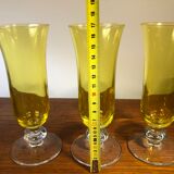 Large transparent yellow champagne flutes
