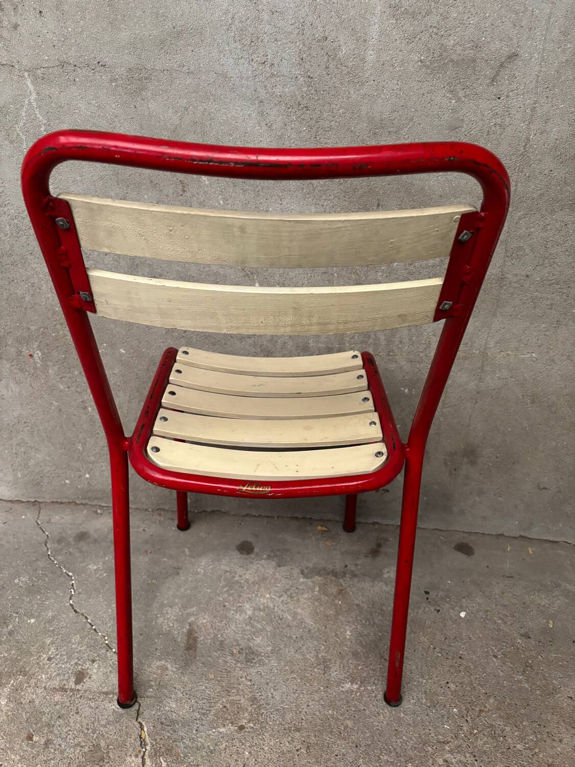 Red and white Tolix chair