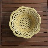 Yellow openwork woven earthenware basket