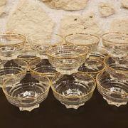 Set of 17 elegant bowls with gold rims