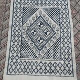 Traditional white and blue hand-woven wool carpet