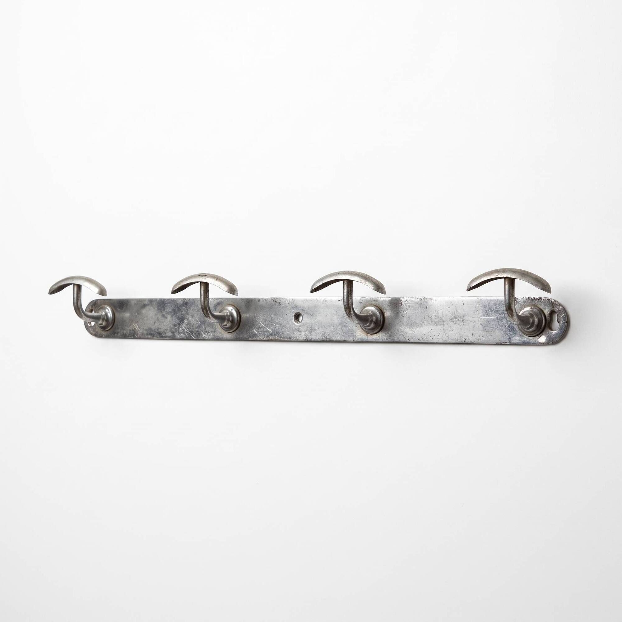 Vintage chrome wall coat rack with 4 hooks, modernist/industrial design.