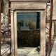 Imposing fireplace mirror in carved and painted wood, 19th century.