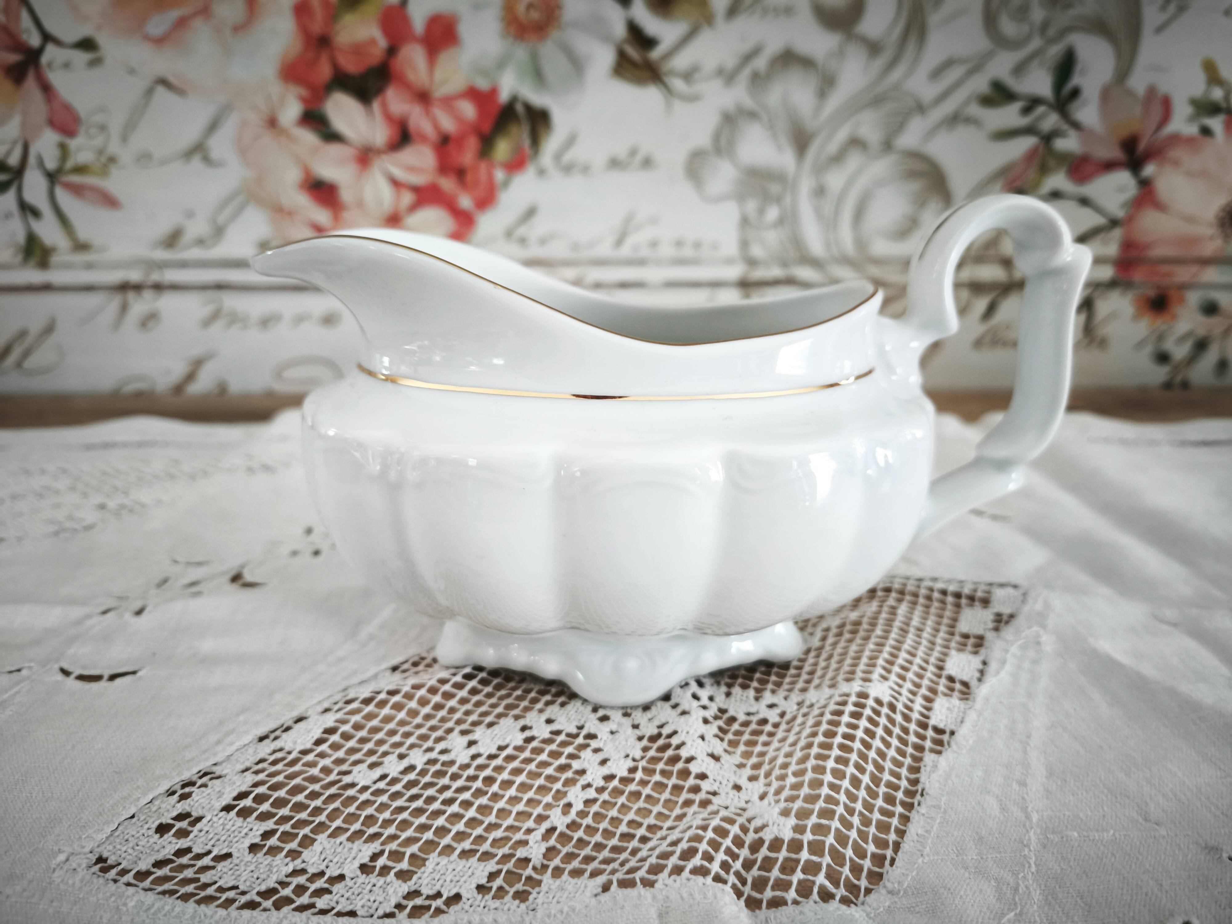 Porcelain sauceboat, white manufacture with double gold line, hand-painted.