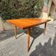 Scandinavian extendable dining table in teak veneer.
