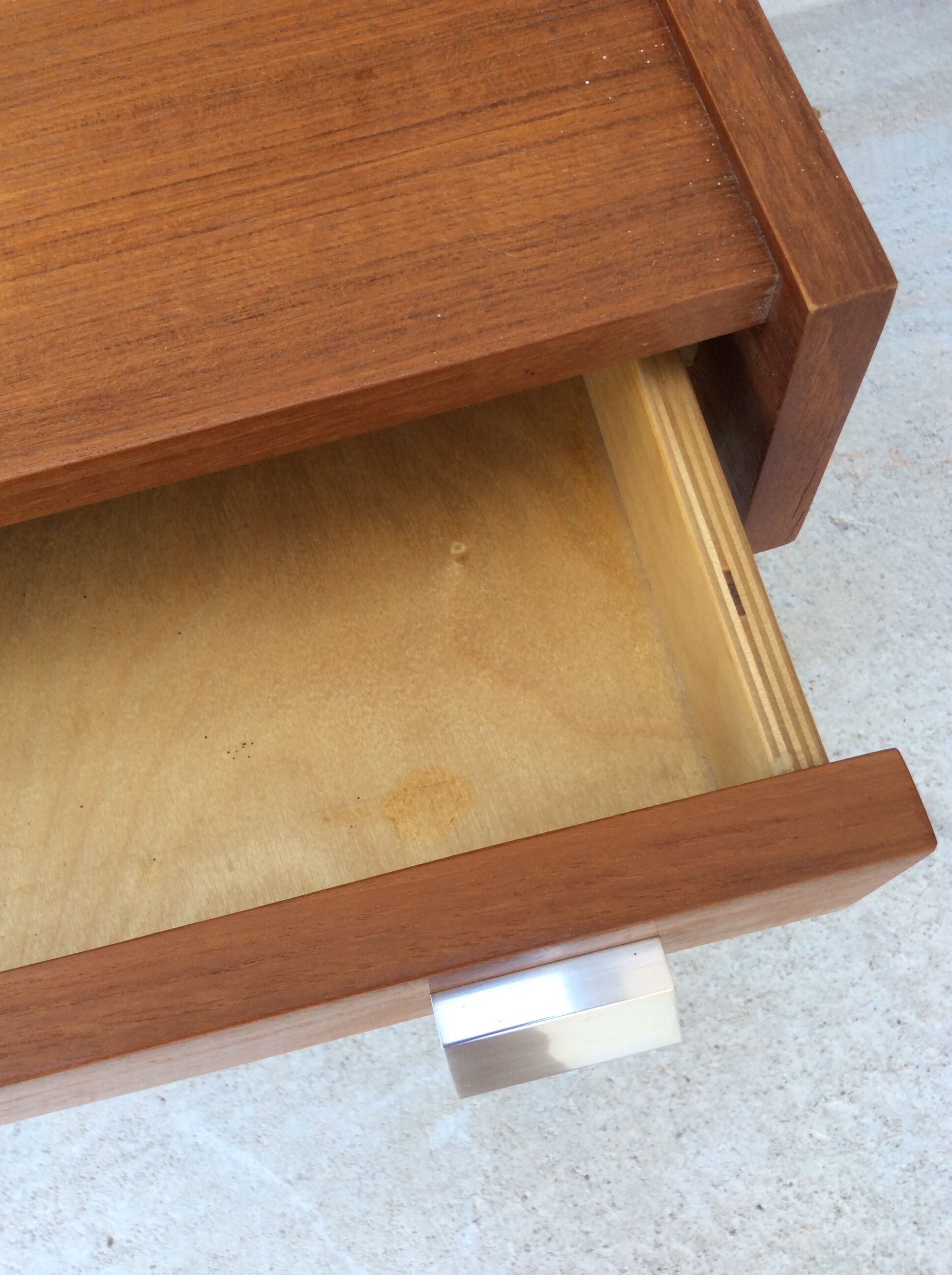 Scandinavian-style teak bed with integrated nightstands