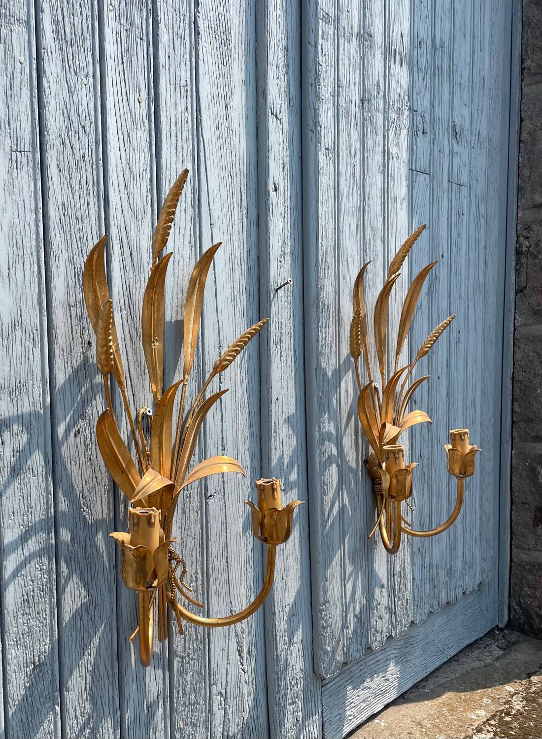 Pair of wall sconces in the shape of a wheat sheaf with two lights.