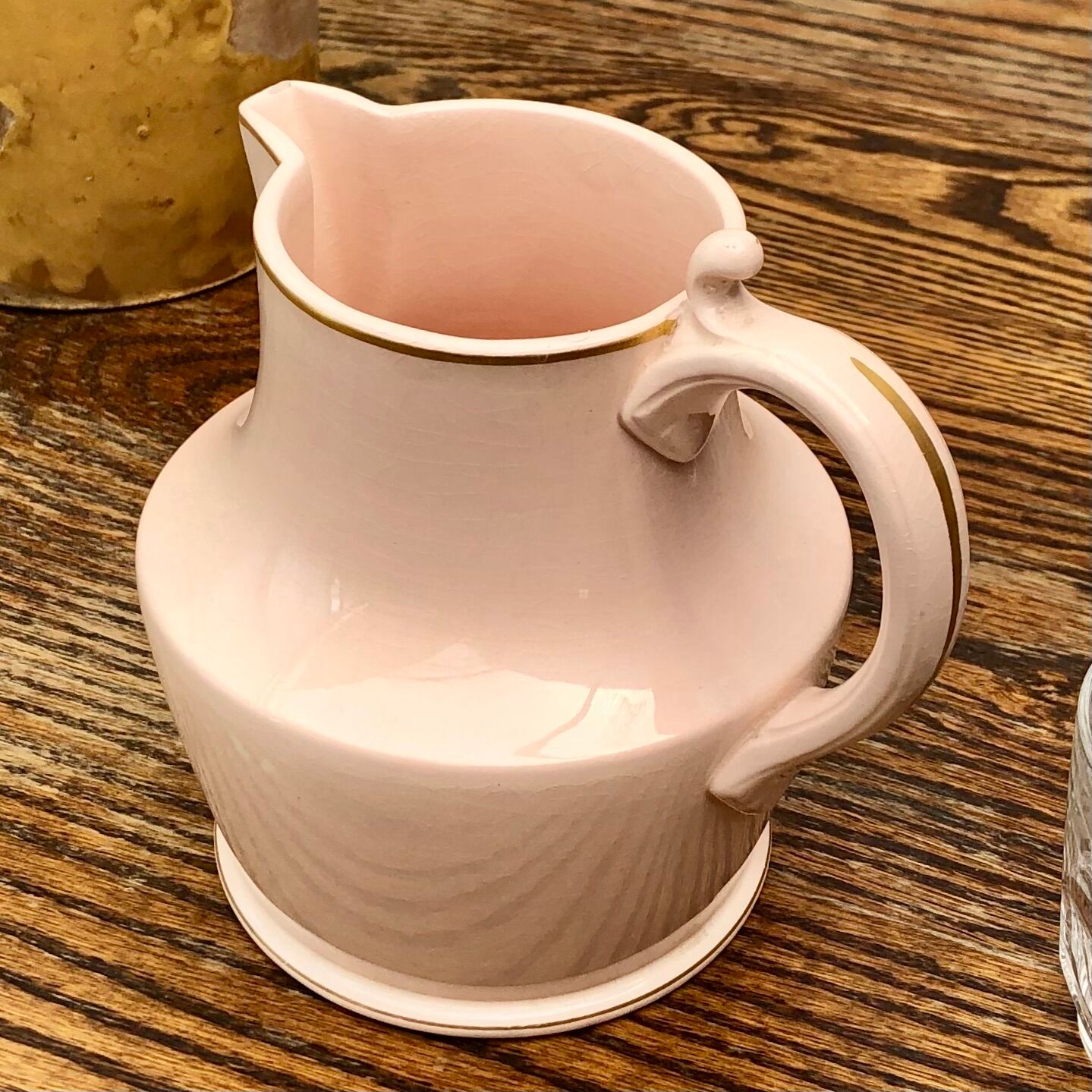 Antique pitcher in pink ceramic