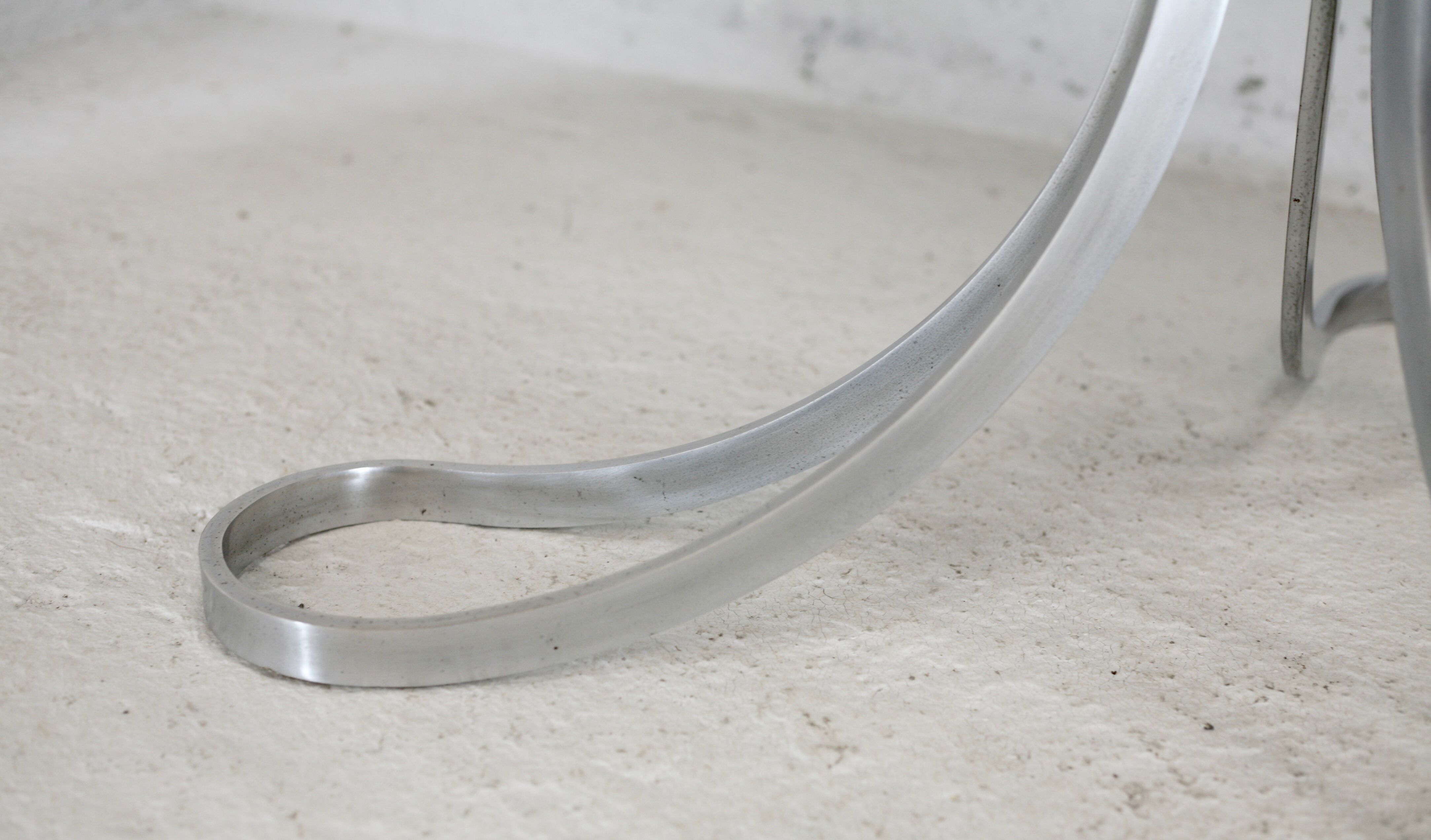 Living room table "Space Age" polished steel, circular slab smoked glass. France, circa 1970.