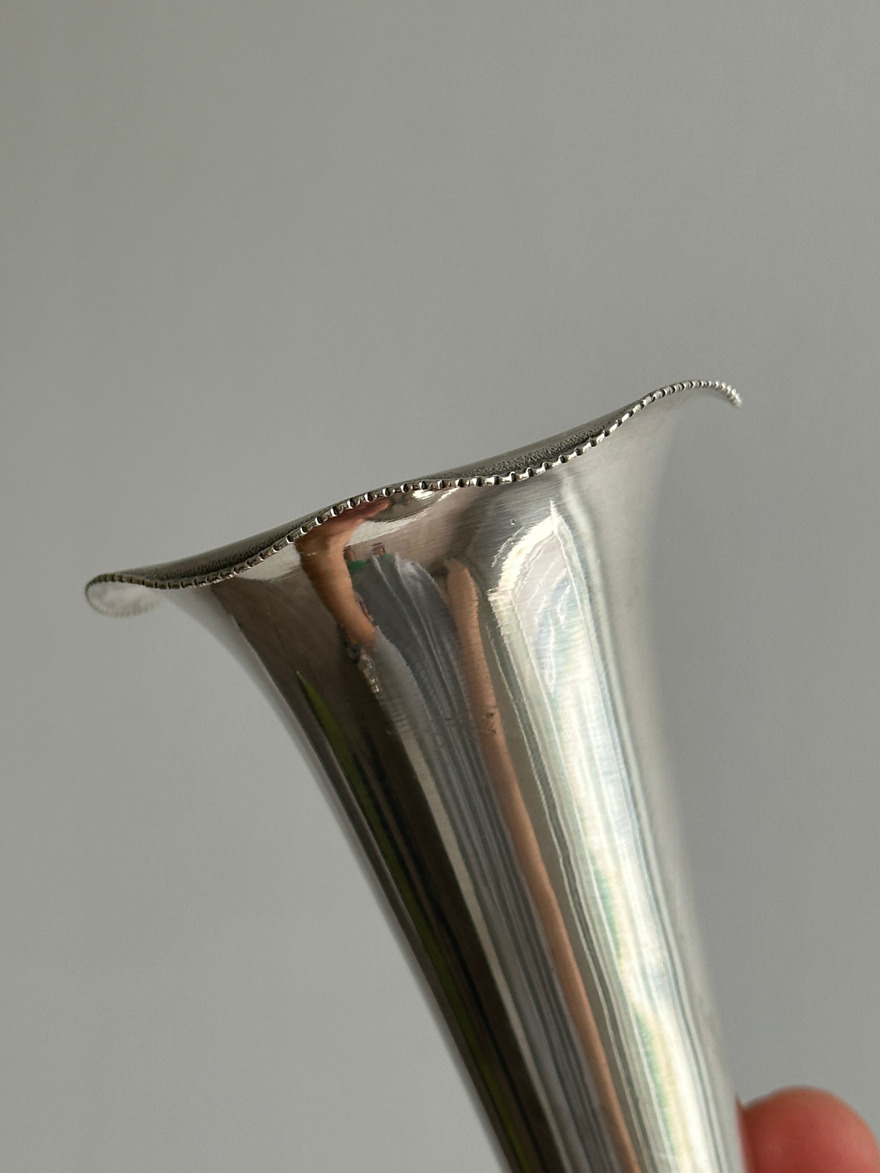 small antique silver-plated metal vase