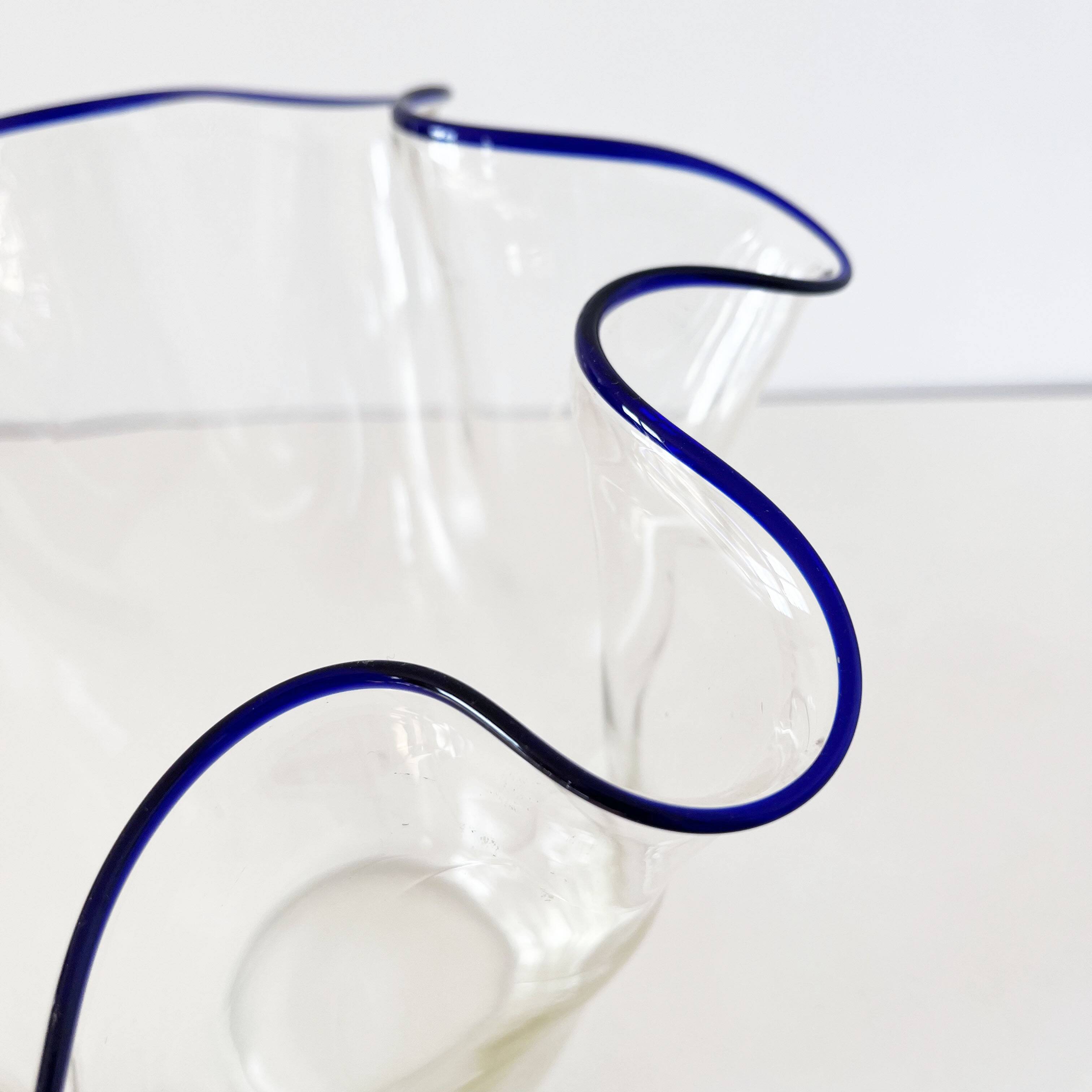 Blue-edged blown glass handkerchief vase