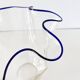 Blue-edged blown glass handkerchief vase