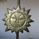 Pair of "sun" candlesticks in metal and wood from the 80s