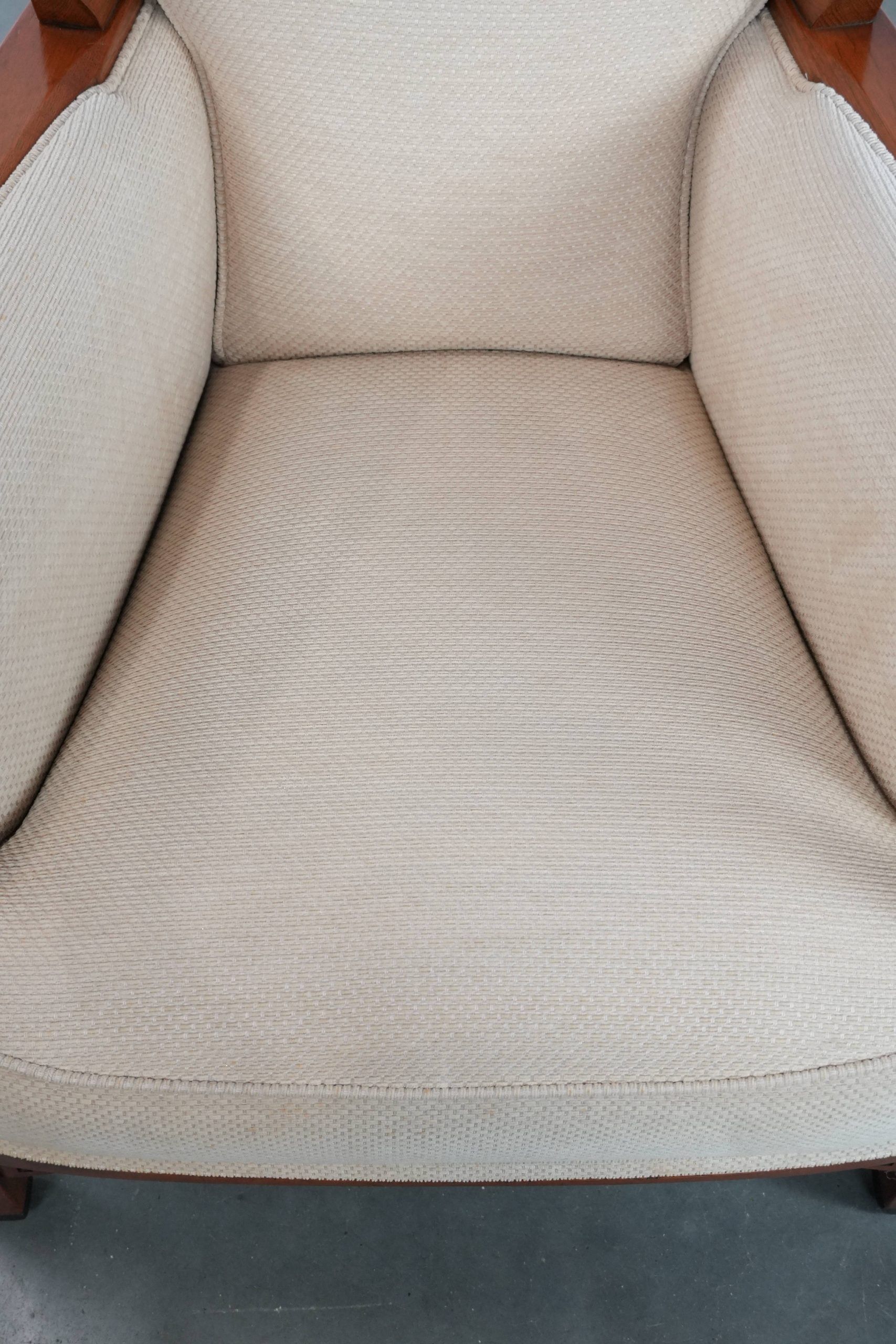Art Nouveau design armchair with a luxurious light fabric upholstery