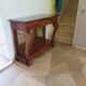 Empire/Restoration style console table with scrolled ends, mirrored back, and claw feet.
