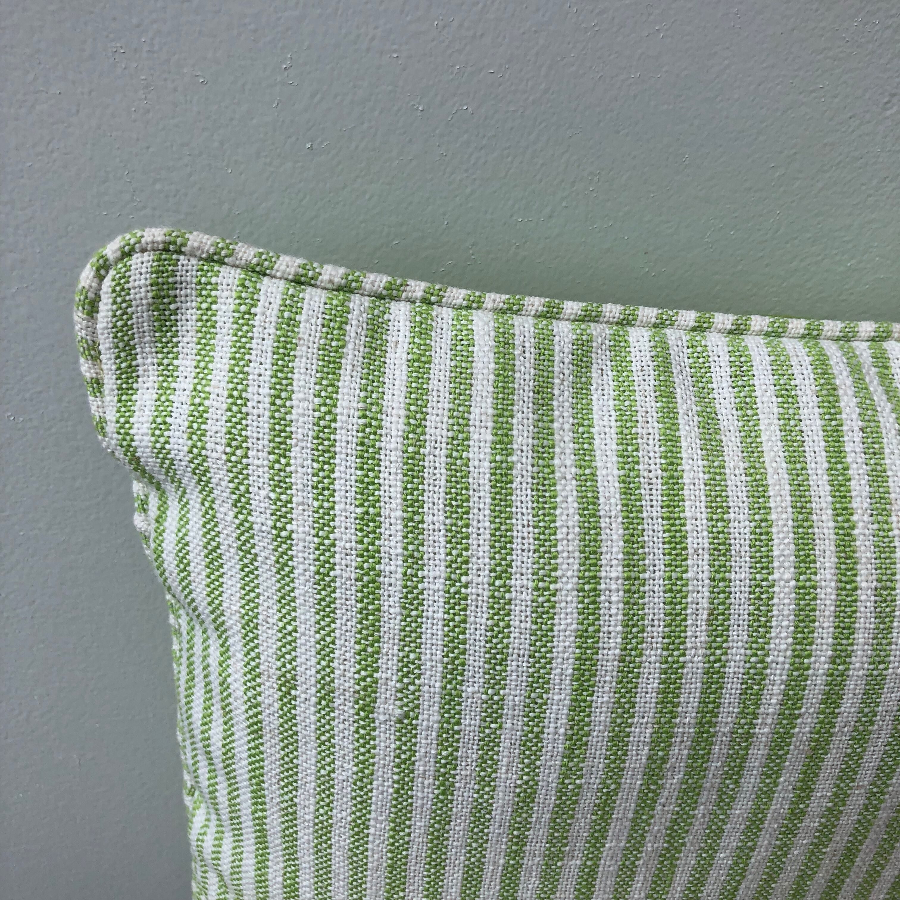 Green and white striped cushion
