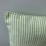 Green and white striped cushion