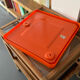 Orange moulded plastic mirror