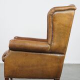 Sheep leather wingback chair with patina