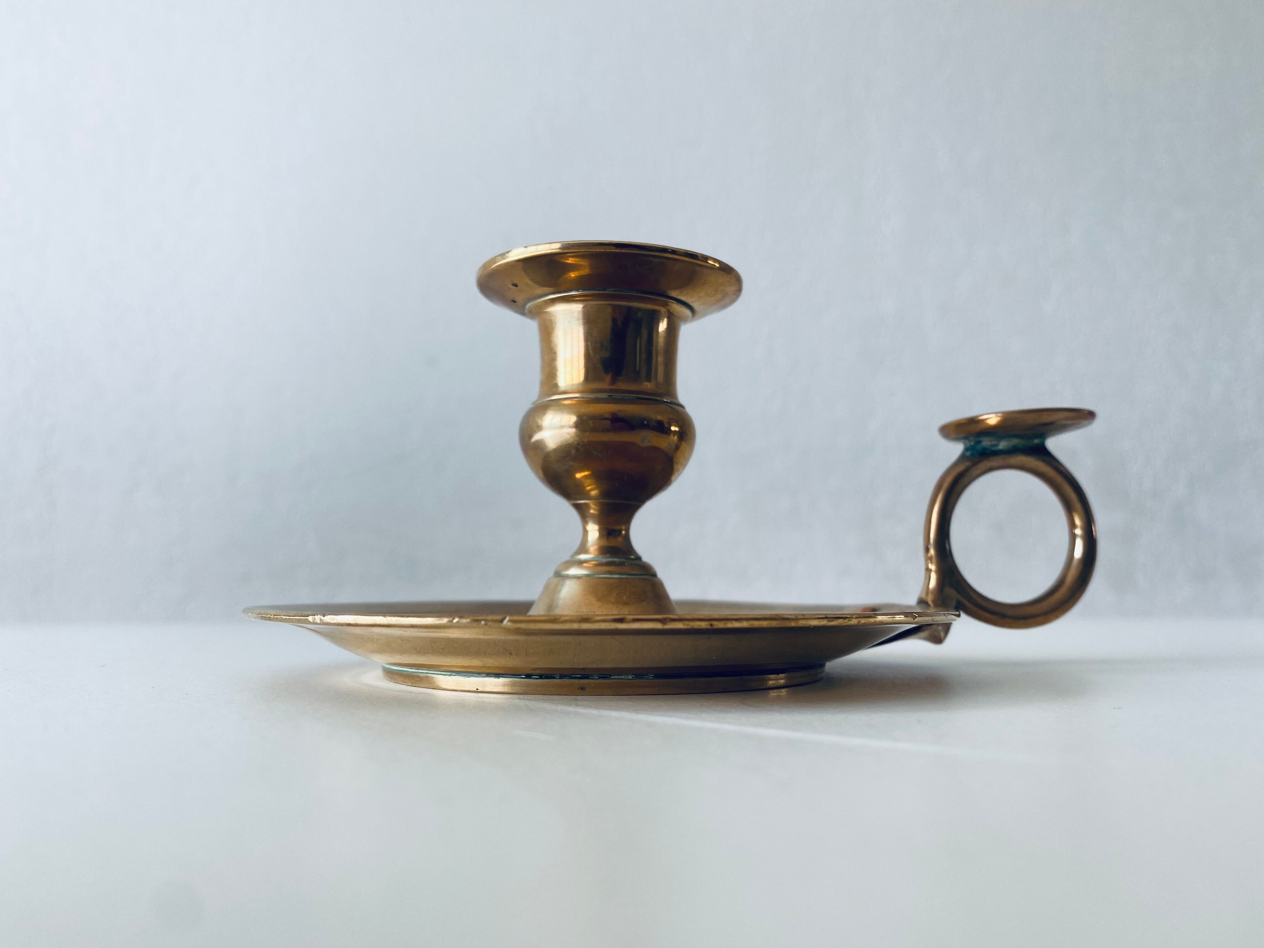 Old candle holder with handle