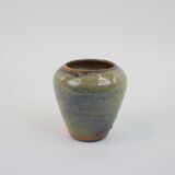 Small beige glazed ceramic vase with abstract relief pattern
