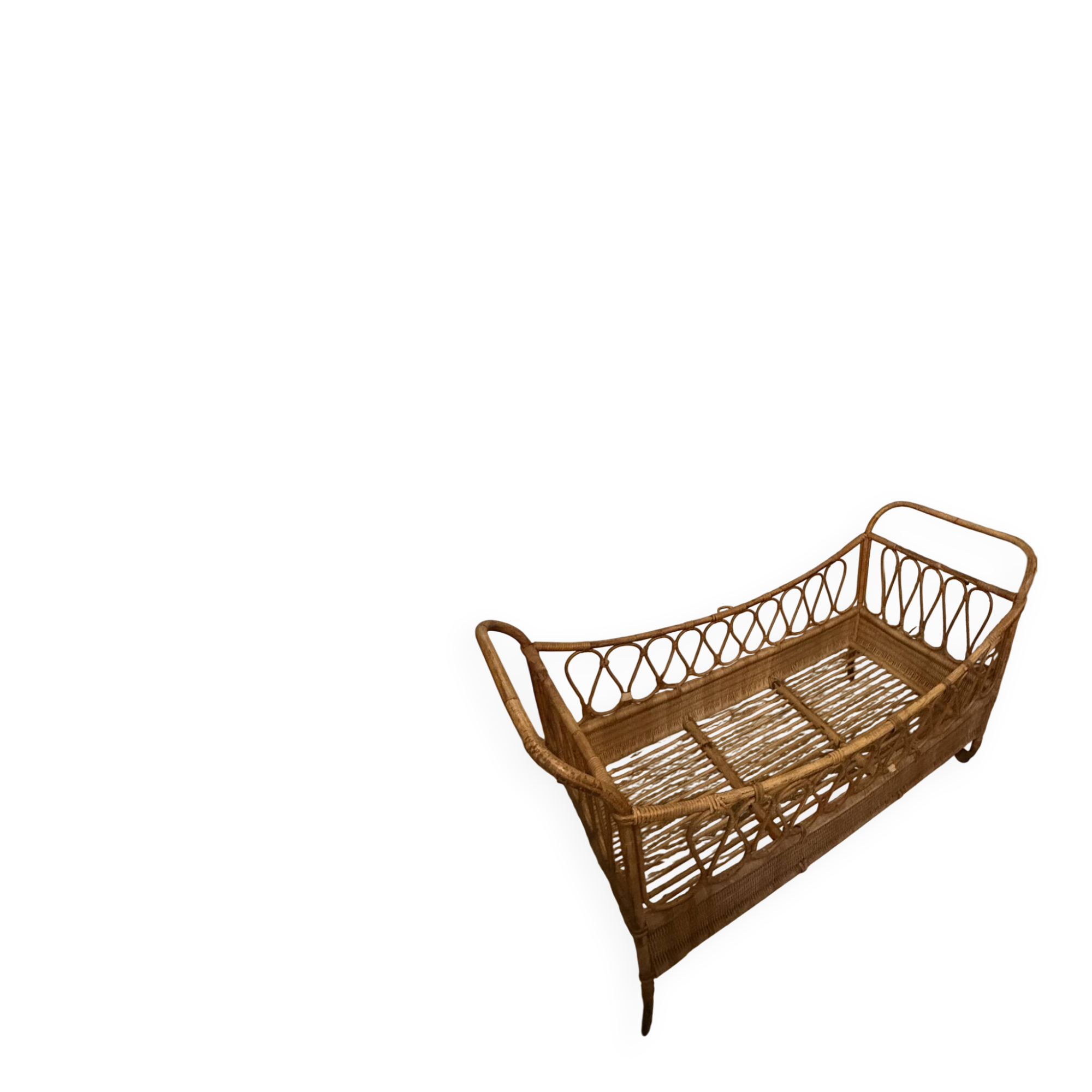 Vintage rattan baby cot on wheels.