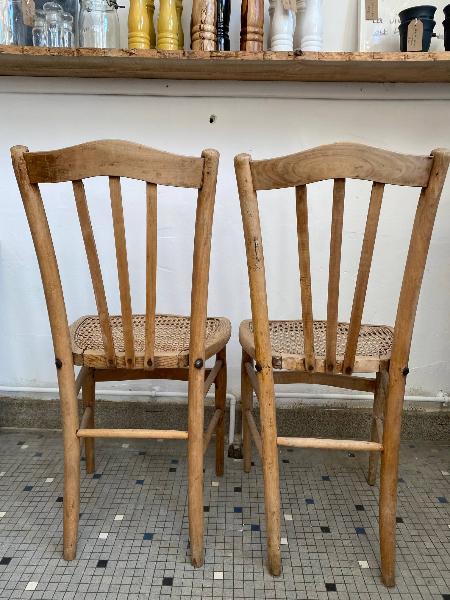 Pair of caned bistro chairs