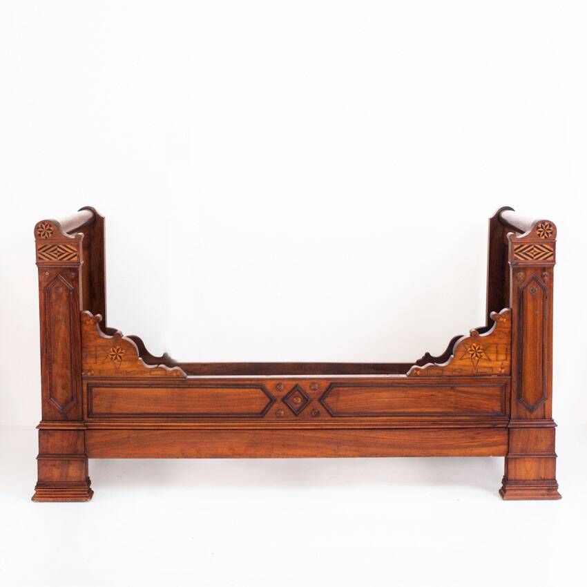 Bed made of solid walnut with marquetry details. France, 1930s.