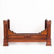 Bed made of solid walnut with marquetry details. France, 1930s.