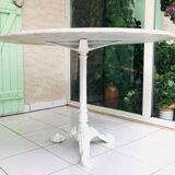 Round marble table with central cast iron leg