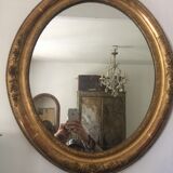 Miroir ovoïde dorure a la feuille d'or, debut xxème