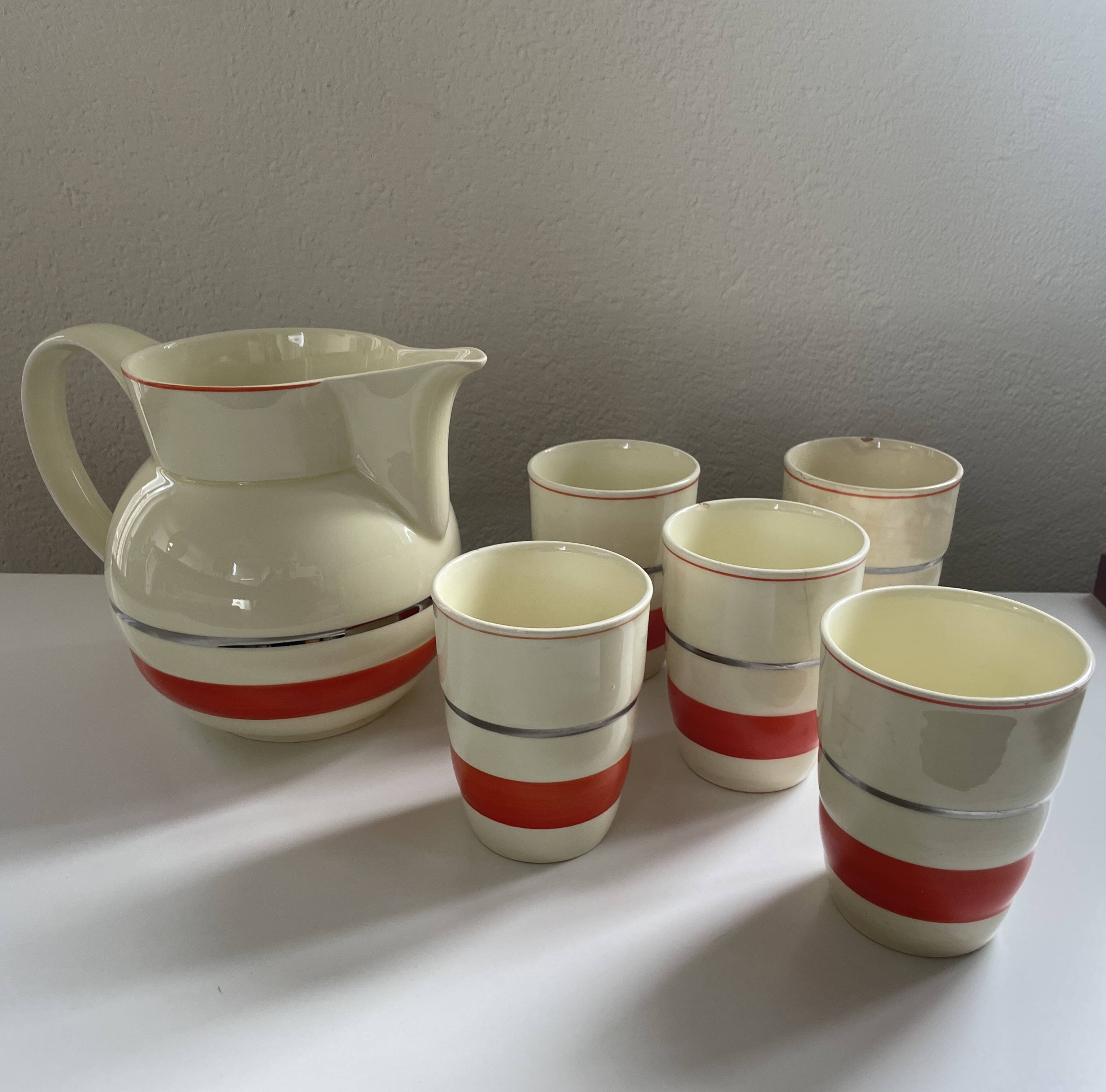 Red, white and silver porcelain jug set by Edmond Bellefroid for Robo.
