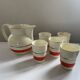 Red, white and silver porcelain jug set by Edmond Bellefroid for Robo.
