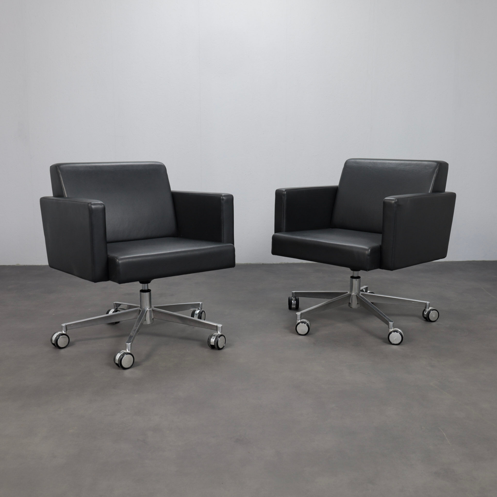 Pair of leather swivel armchairs by Poltrona Frau, Italy, 1990s