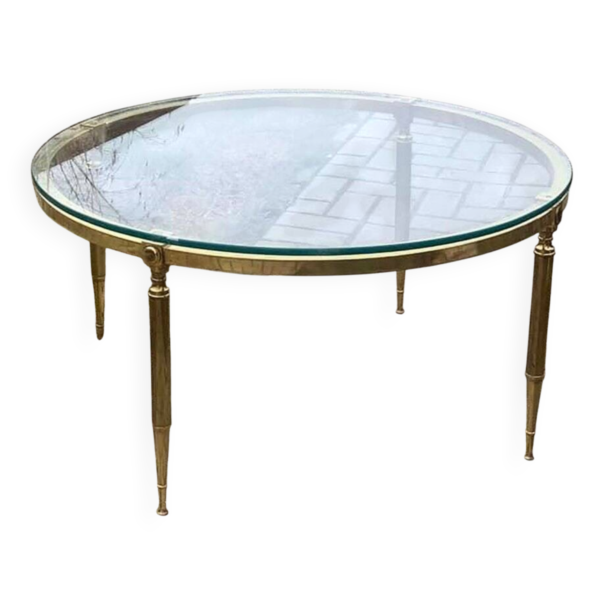 Round coffee table in gilded brass with a transparent glass top, 1960s design.