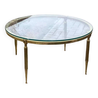 Round coffee table in gilded brass with a transparent glass top, 1960s design.
