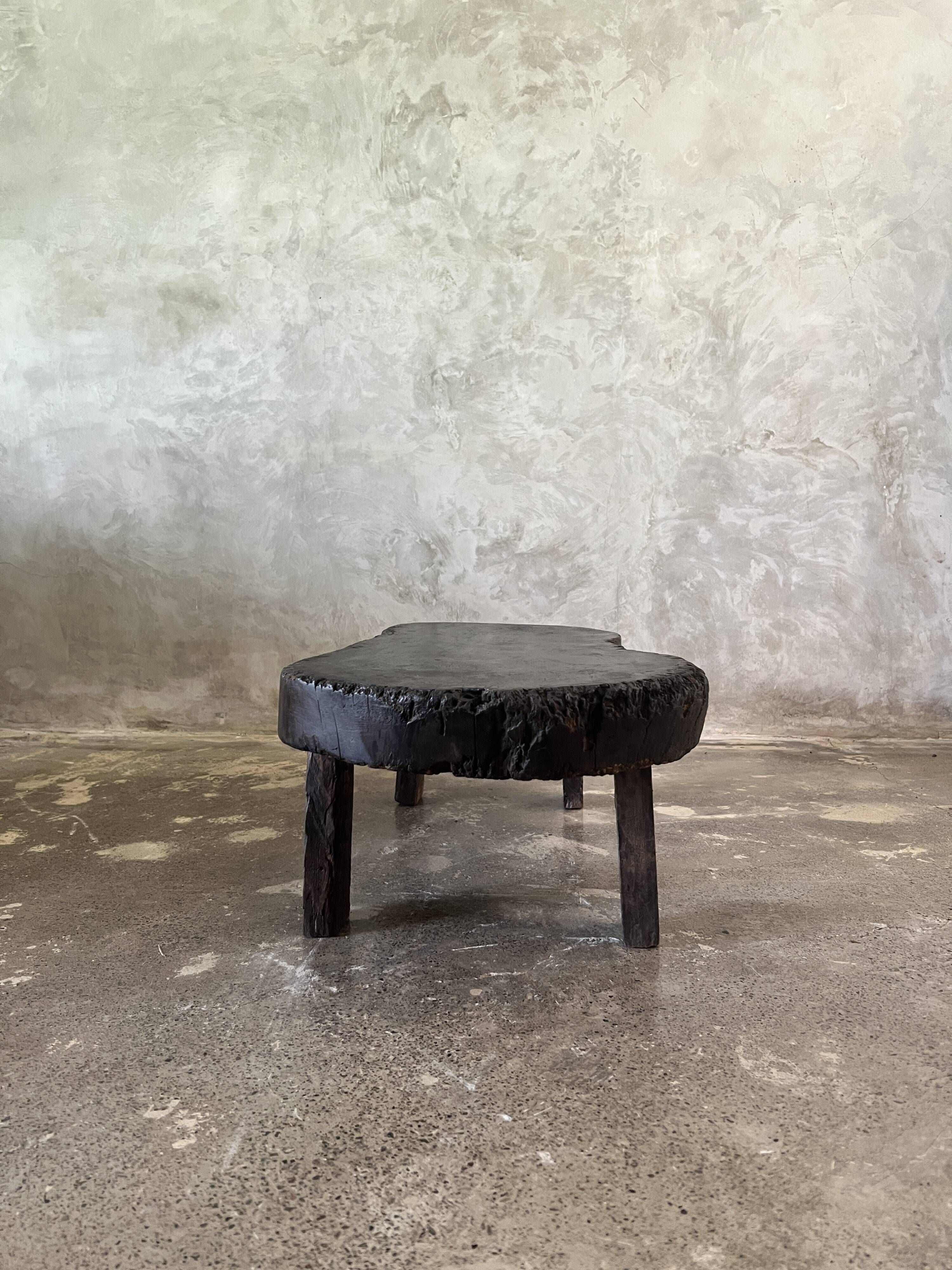 Small old Asian wooden coffee table in Japanese style, kidney-shaped top