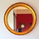 Round golden mirror, 1970.