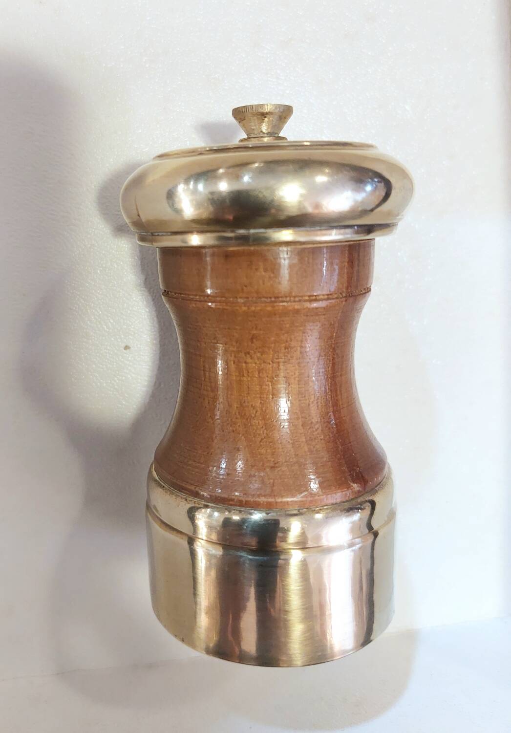Varnished wood and brushed brass pepper mill