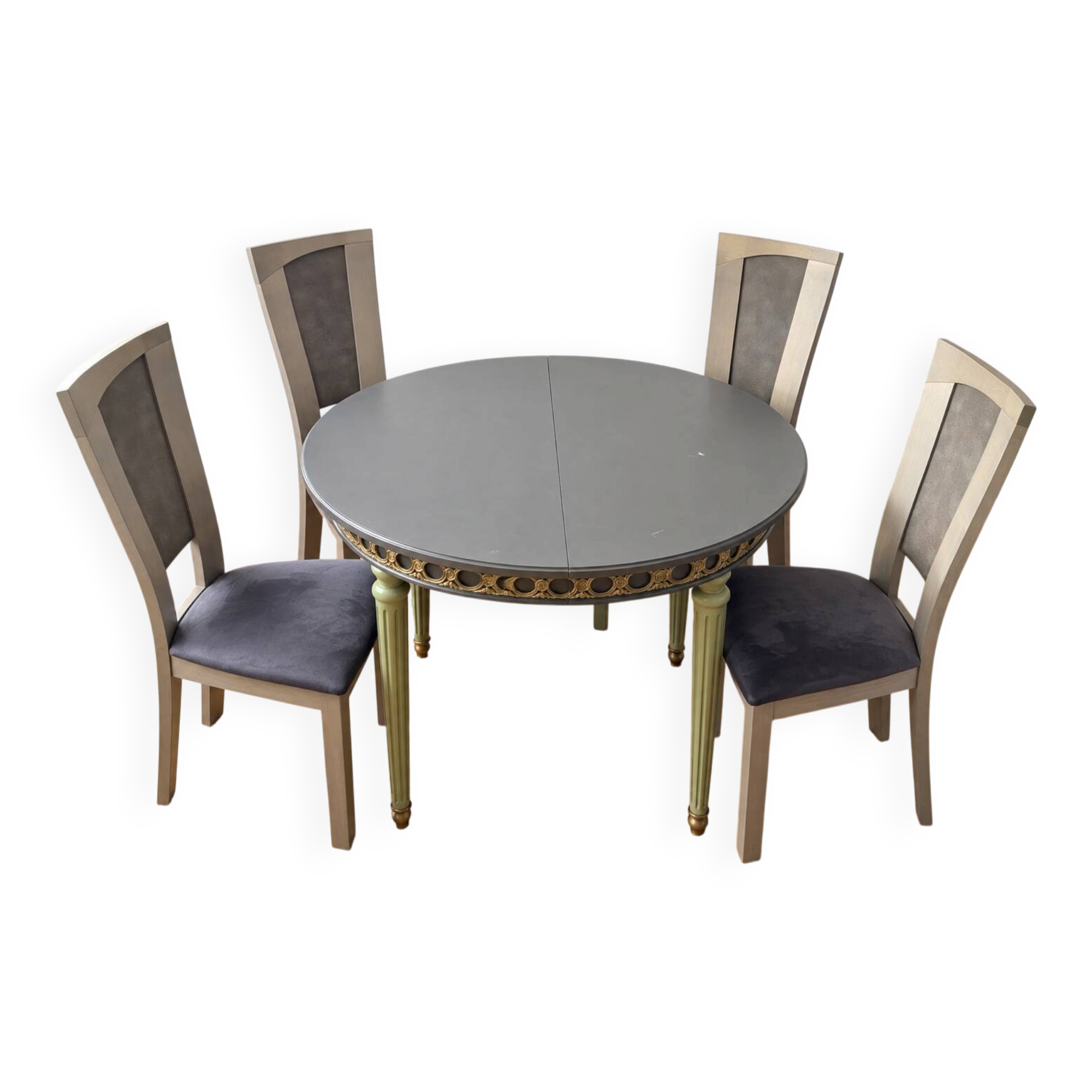 Extendable round table, 2 extensions, and 4 grey velvet chairs.