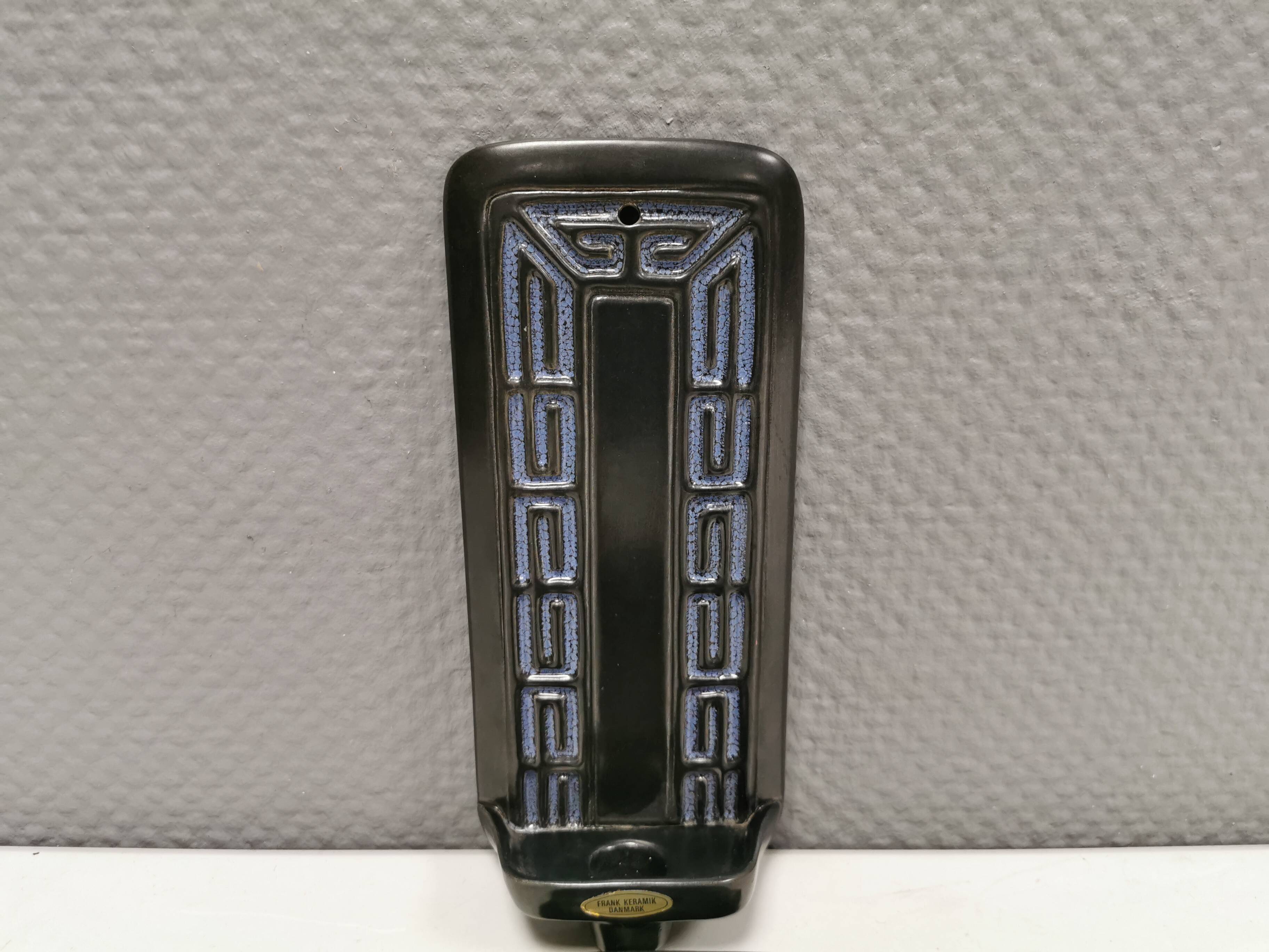 Two wall-mounted candlesticks by Danish Frank Ceramics 1970s.