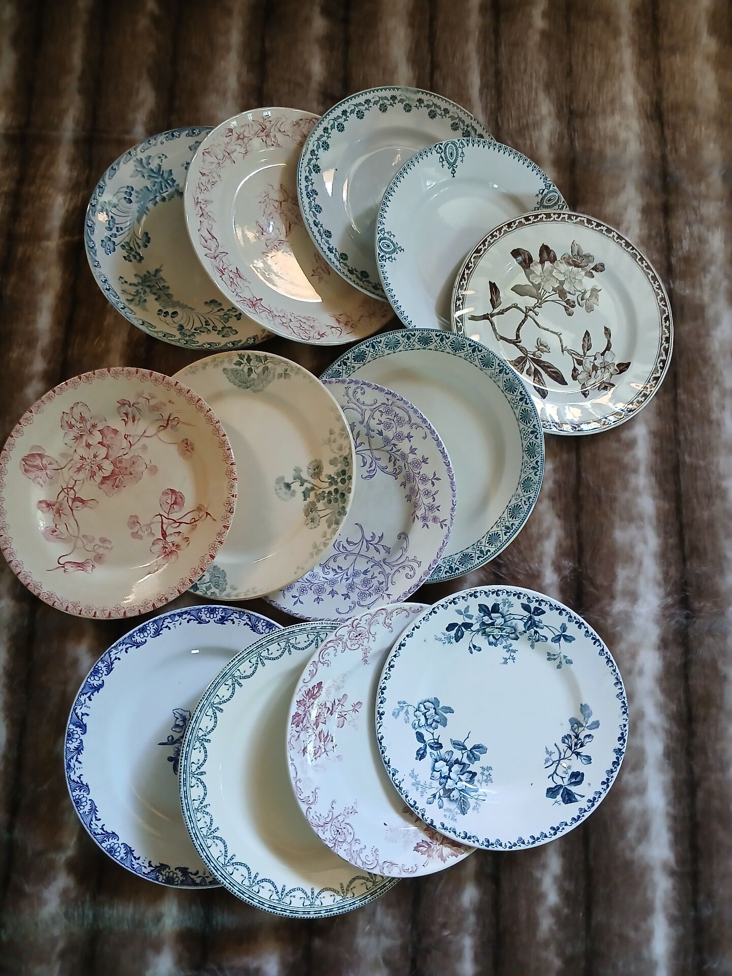 13 mismatched flat plates in ironstone