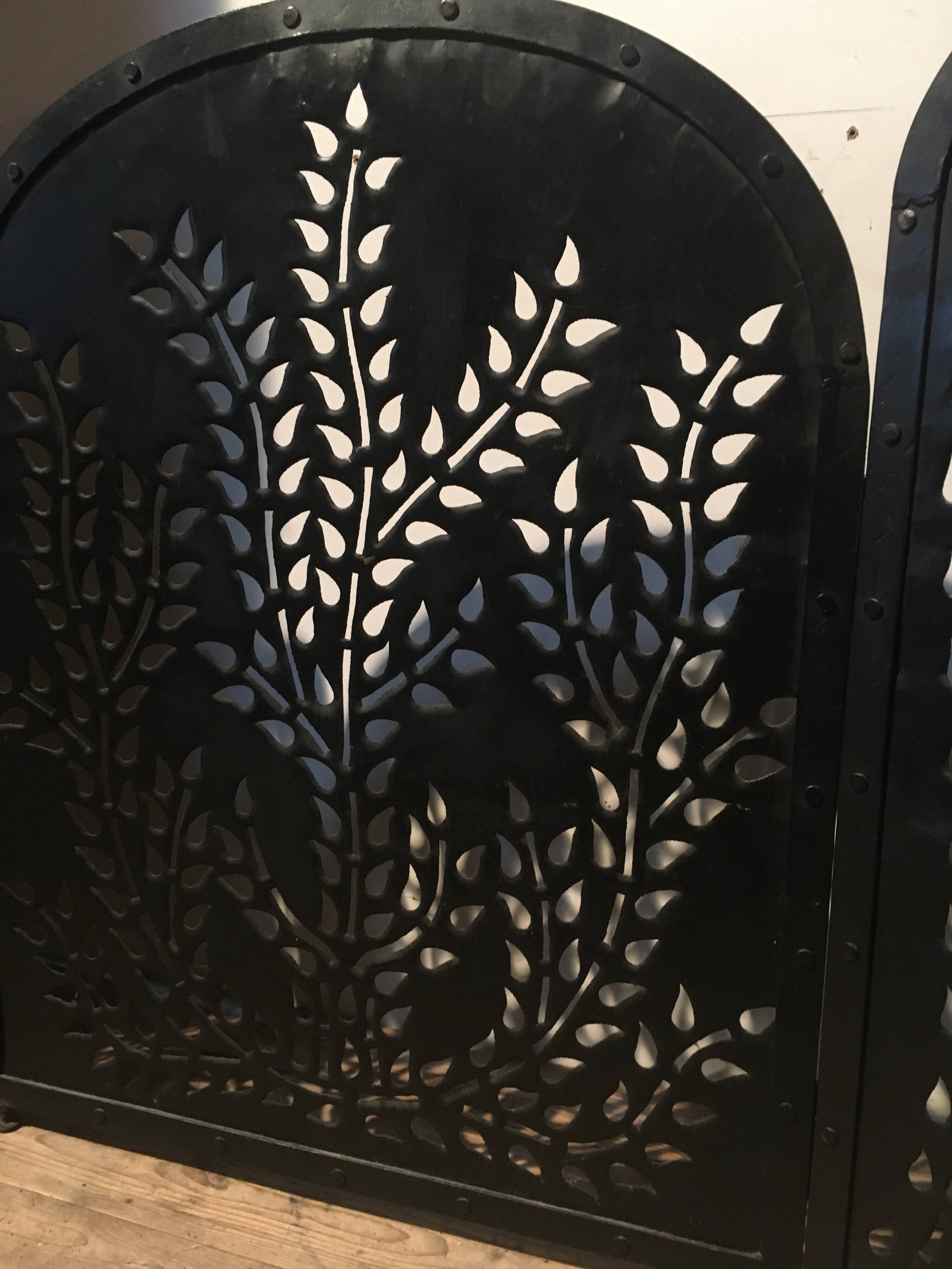 Wrought and cut metal fire screen