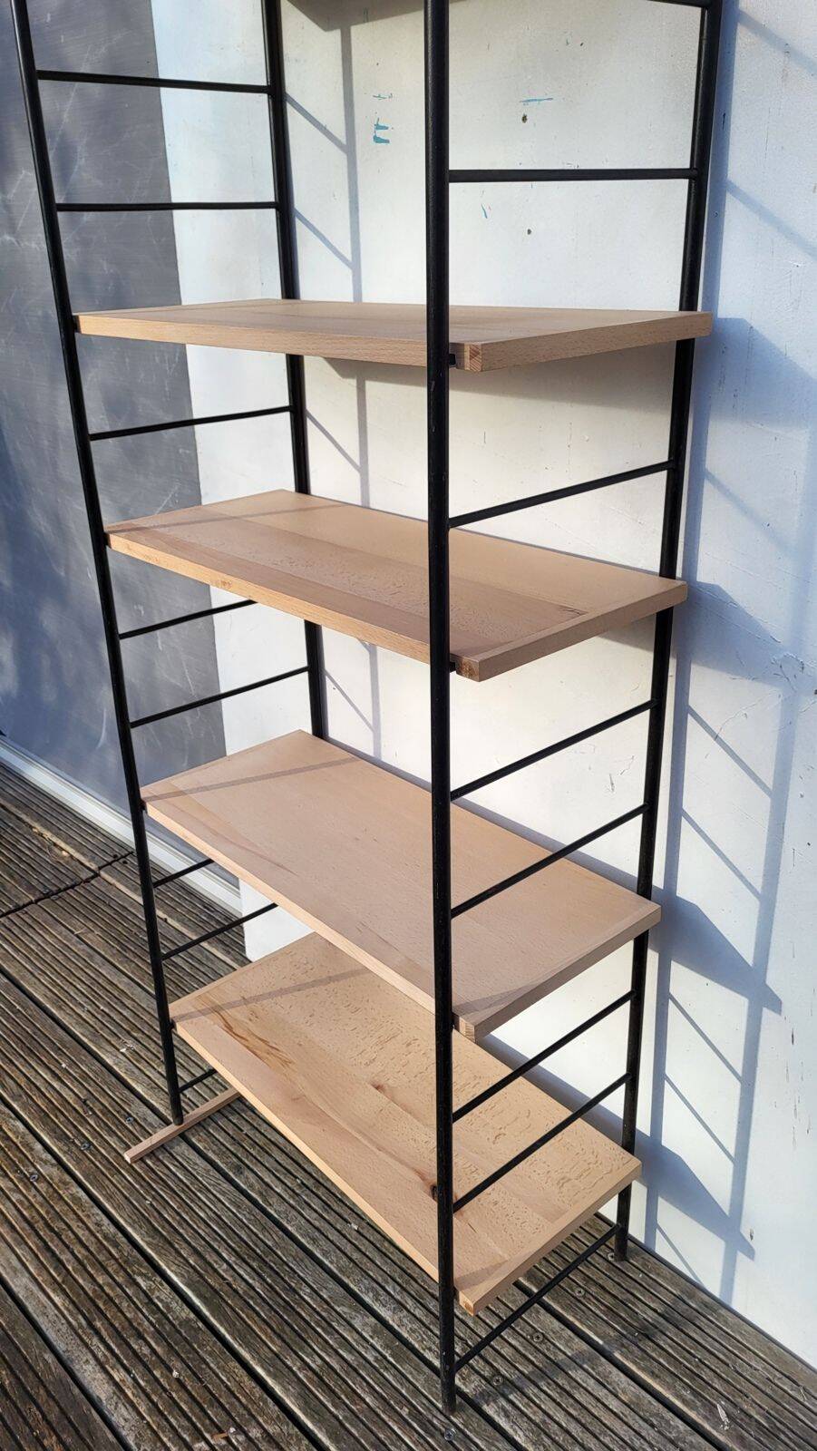 Large String shelf with wooden ladders and metal.