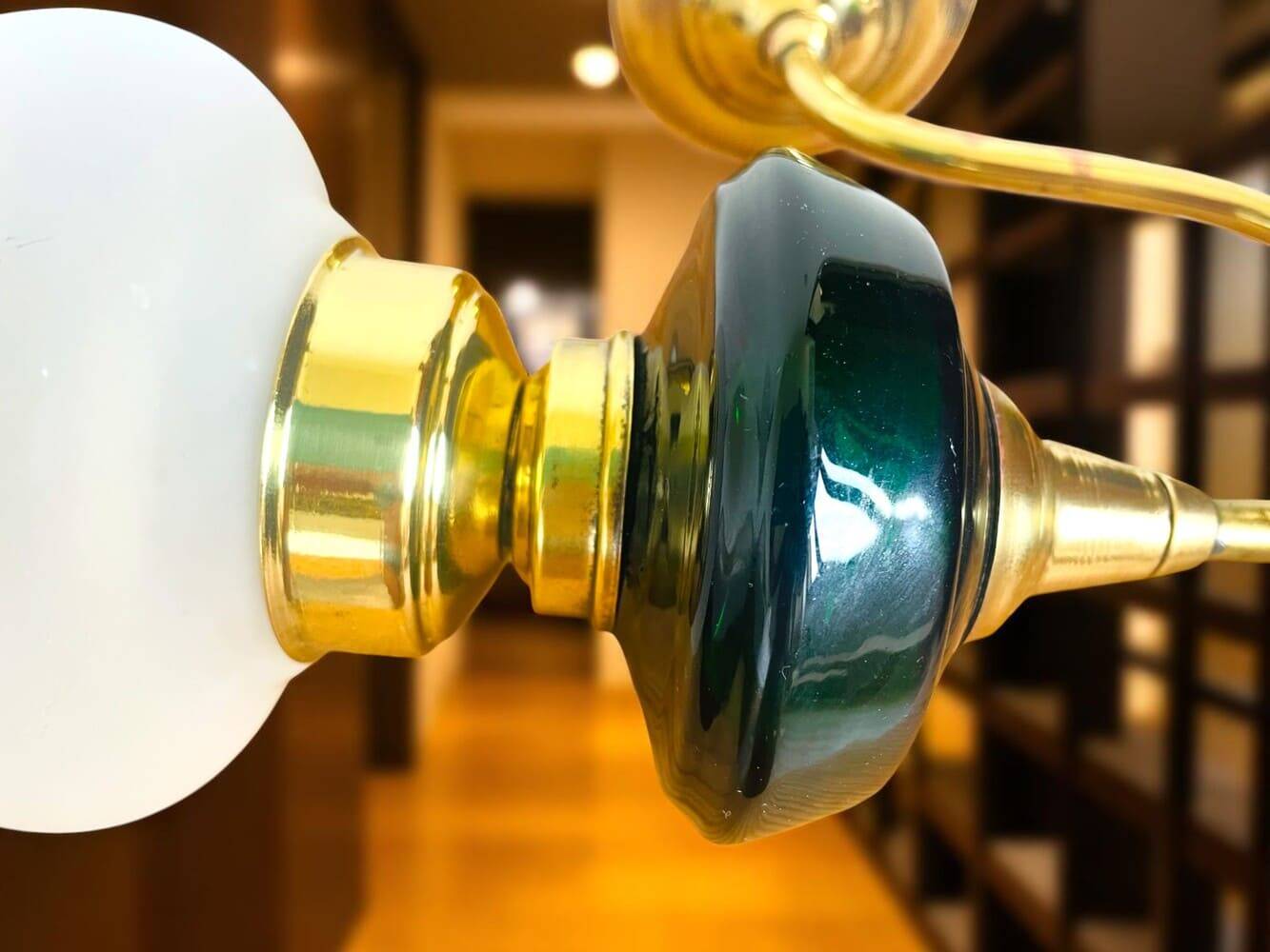 Brass wall sconce with frosted glass tulip lampshade