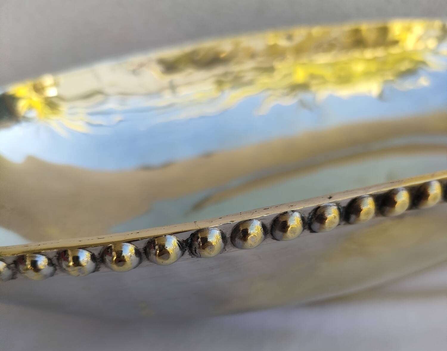 Studded silver metal basket