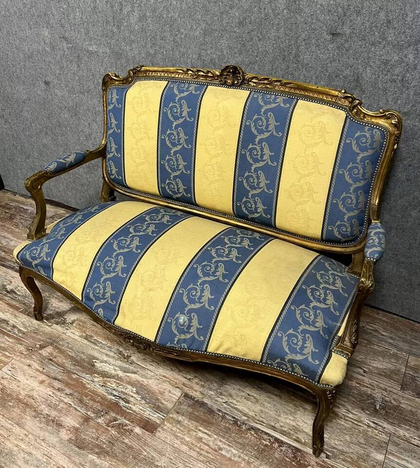 Louis XV style bench in gilded wood, 20th century