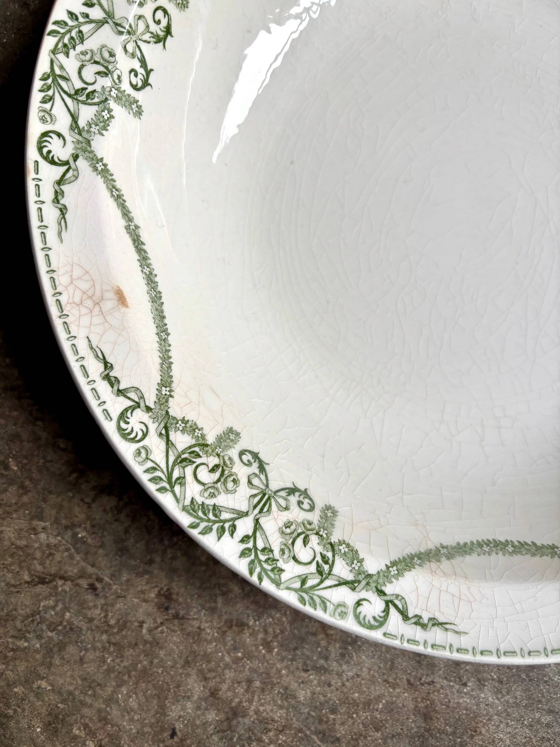 Round, deep Creil & Montereau dish in green earthenware, "Napoleon" service
