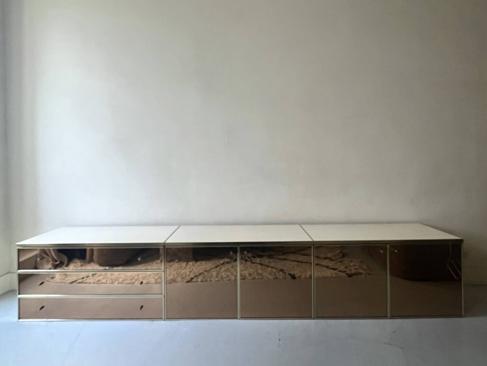 Low ivory lacquered enfilade, smoked mirror & brass JC Mahey, design 1970.