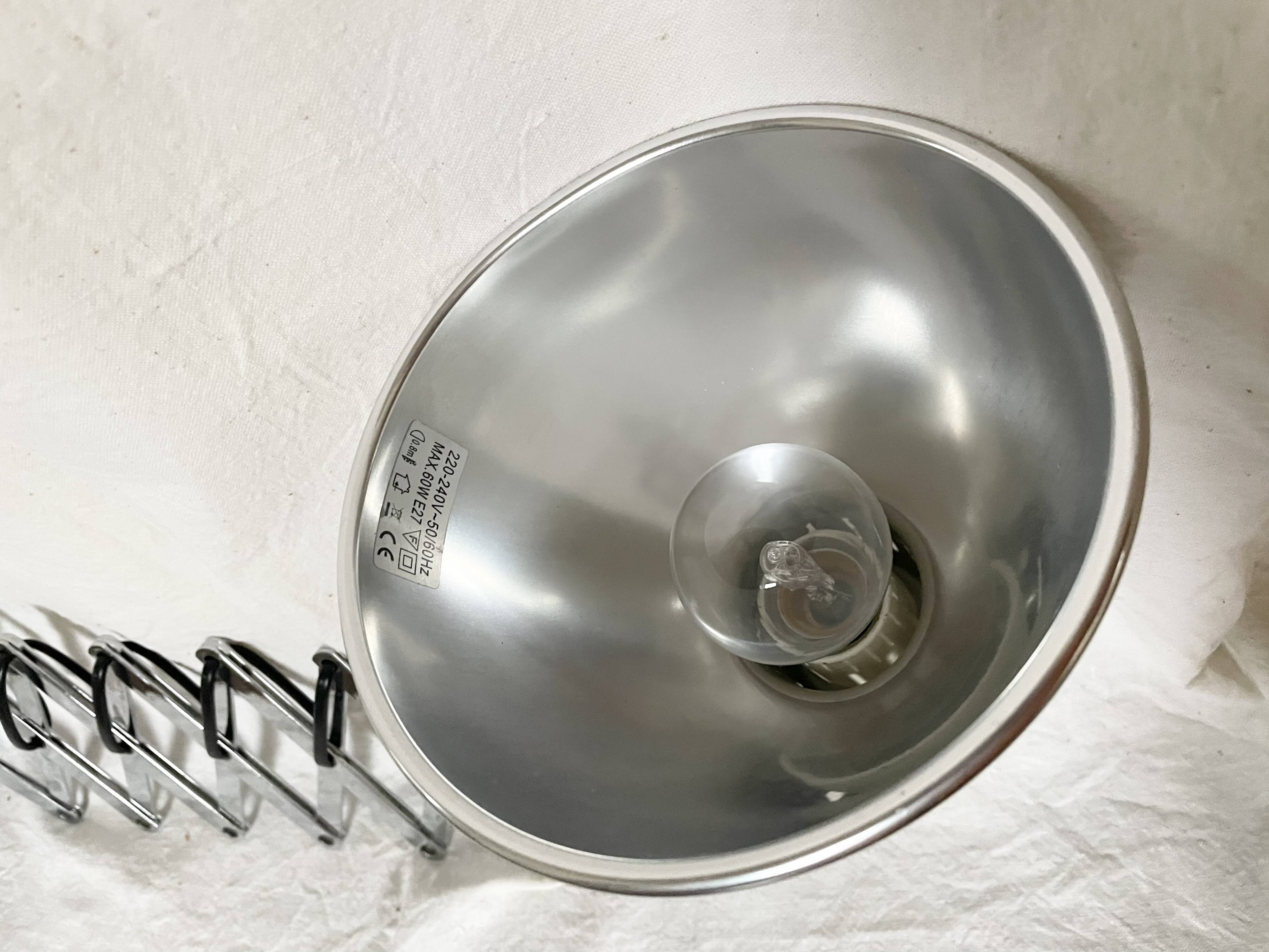 Vintage accordion wall light in chrome metal.